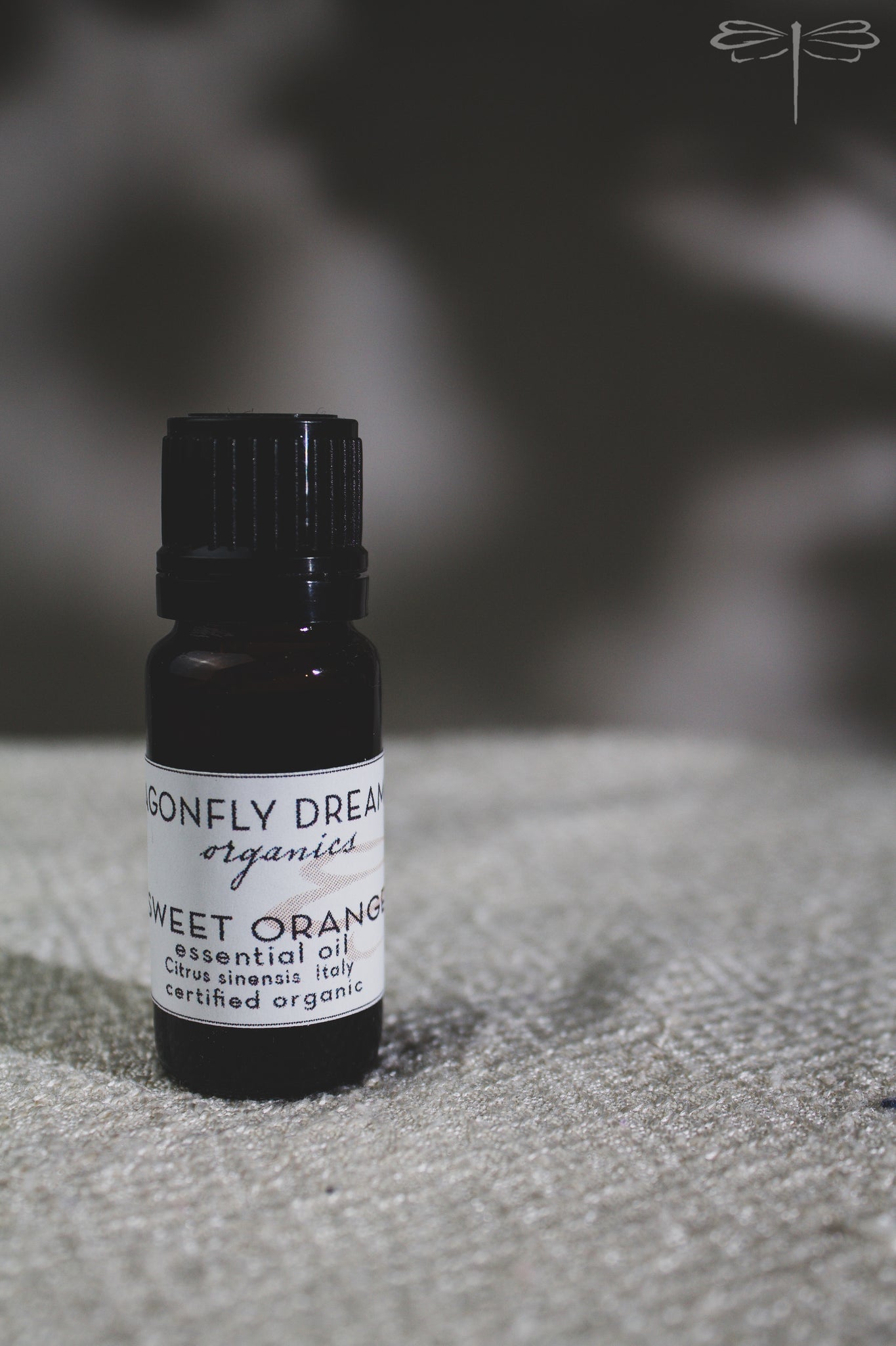 Pictured here, Certified Organic Sweet Orange Essential Oil by Dragonfly Dreaming Organics