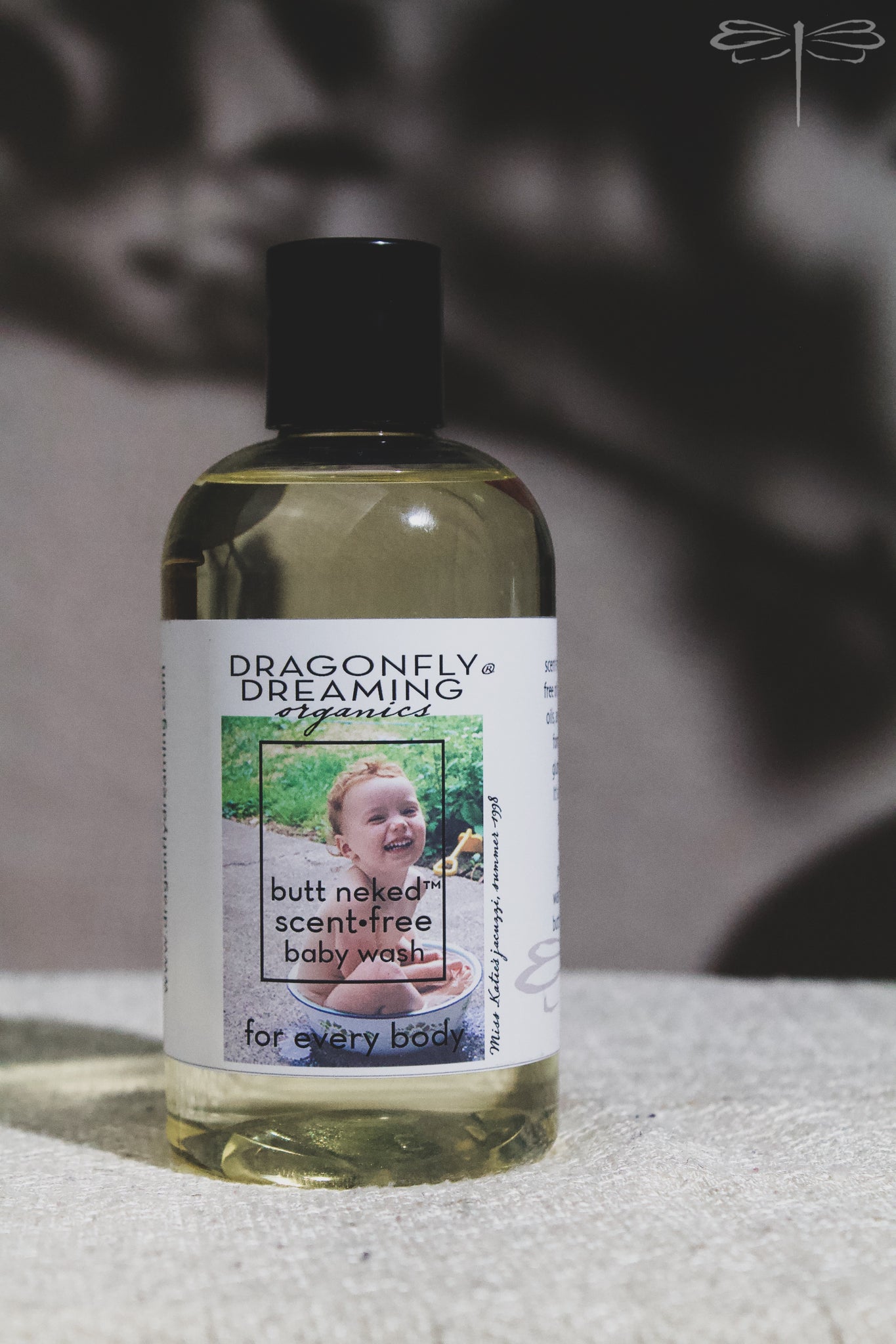Pictured here, a 250mL bottle of Butt Neked Baby Wash  by Dragonfly Dreaming Organics